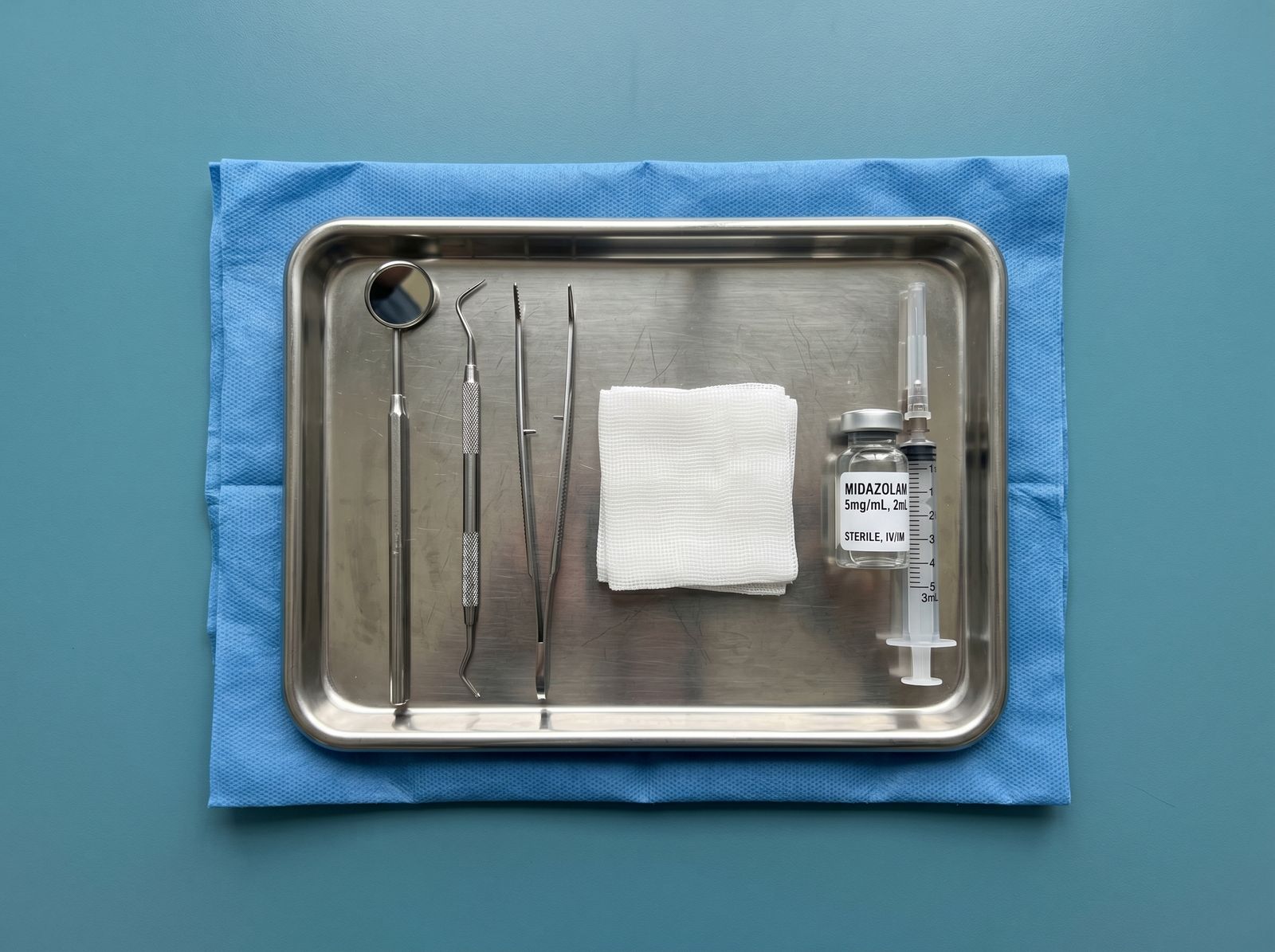 A sterile dental tray with instruments and a sedation medication vial at Hanover Dental Sedation